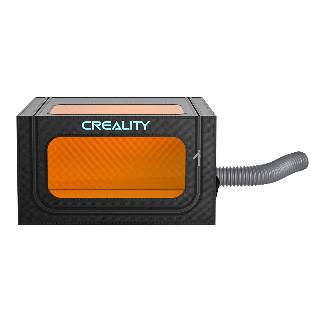 A black and orange rectangular Laser Engraver Enclosure Pro with a transparent front window and the text "CrealityFalcon" on top. A flexible gray exhaust hose extends from the right side, providing a dustproof environment for optimal printing conditions.