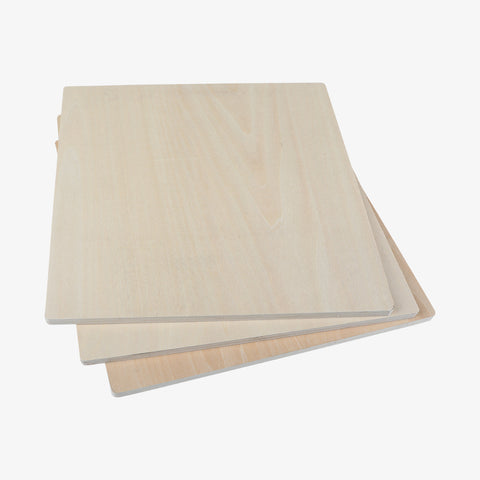 Three stacked sheets of light-colored CrealityFalcon Basswood Plywood Sheets 11.8" x 11.8" for Laser Engraving - Pack of 10pcs, 6pcs and 3pcs with a smooth finish, placed slightly askew on a white background. The wood grain is visible, and the edges are sharp and clean, making them perfect for DIY projects like those created with a laser engraver.