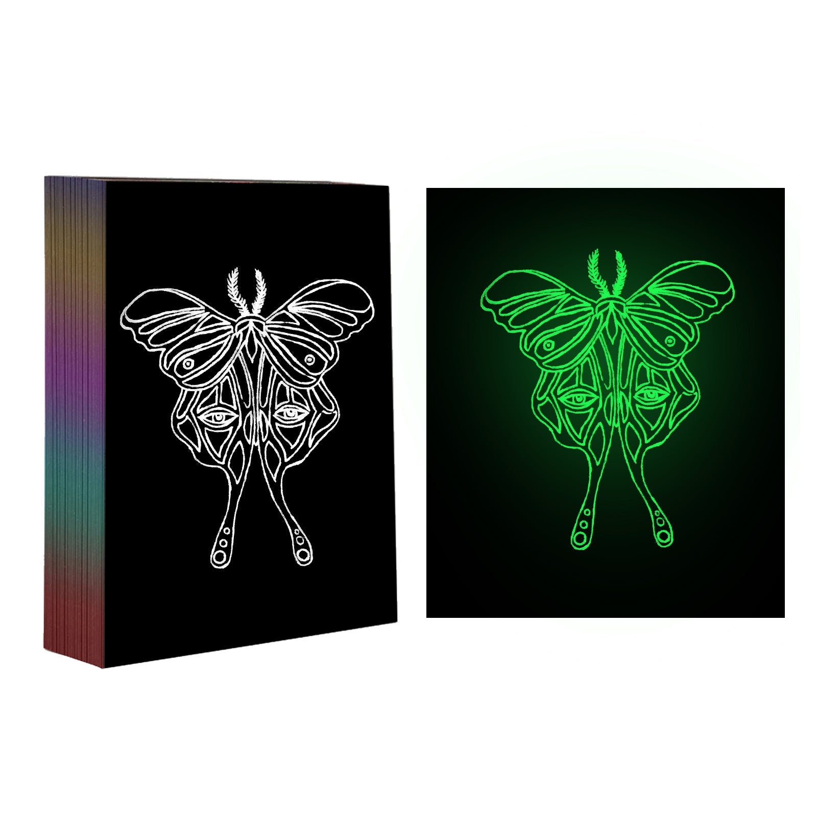 A side-by-side comparison of two images featuring the same intricate moth design. The left image shows the white design on a black background, crafted on CrealityFalcon A4 Luminous Scratch Paper Fluorescent Scratch for Falcon Laser Engraving - Pack of 50pcs. The right image shines with holographic luminous art paper, making the design glow green. There is a stack of similar designs on the left.