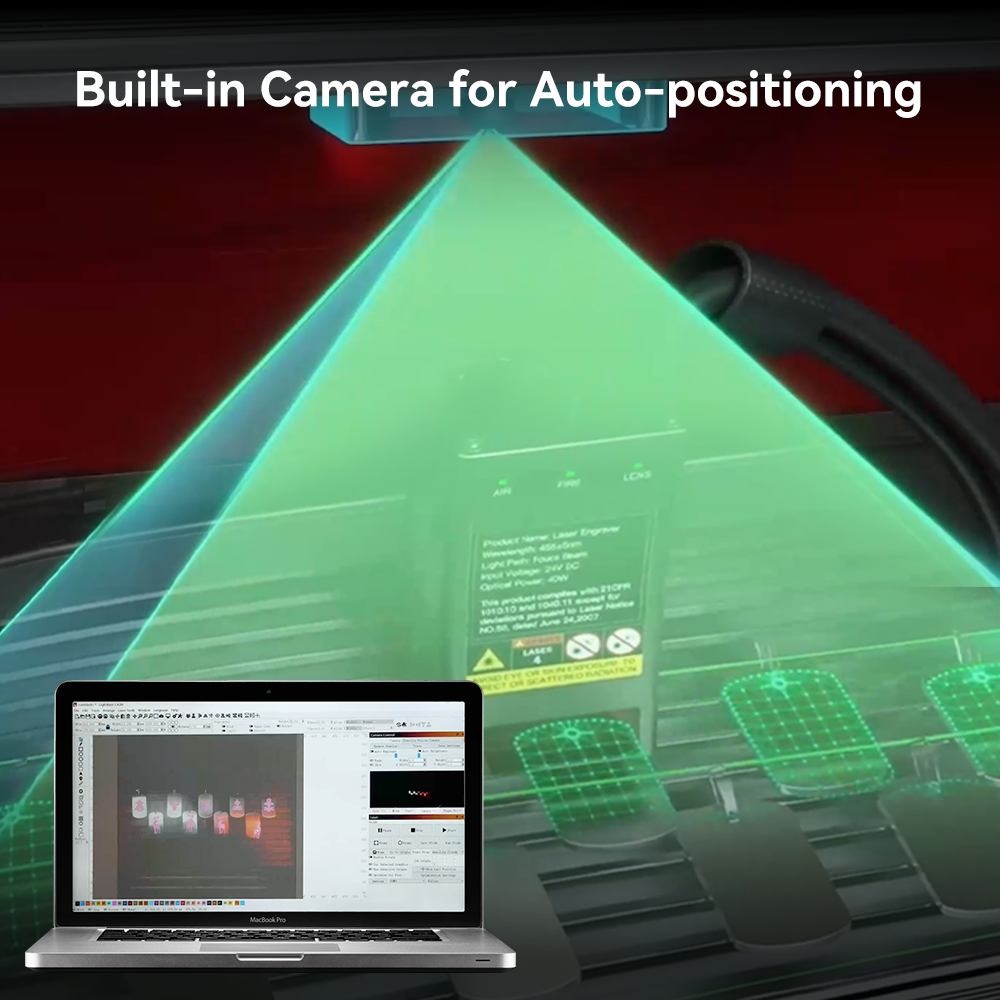 A setup shows a CrealityFalcon Falcon2 Pro 60W Enclosed Laser Engraver and Cutter with a built-in camera projecting a green laser grid for auto-positioning. In the foreground, an adjustable beam aligns perfectly with the laptop screen displaying software controlling the process. Text at the top reads, "Built-in Camera for Auto-positioning.