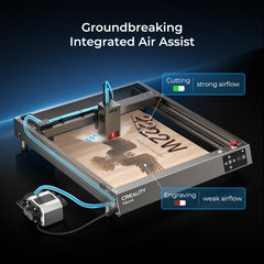 Image of the CrealityFalcon Falcon2 22W Laser Engraver and Cutter Ultimate Engraving Package. The machine highlights its "Groundbreaking Integrated Air Assist" feature, with labels indicating strong airflow for cutting and weaker airflow for engraving. The device is shown in action, laser engraving an intricate design on a surface, showcasing extensive compatibility.